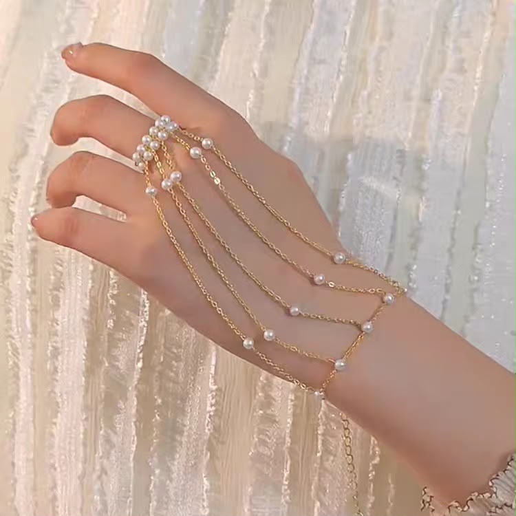 Turn Every Hand Movement Into Pure Elegance ( Pearl Cascade Hand Chain Bracelet )