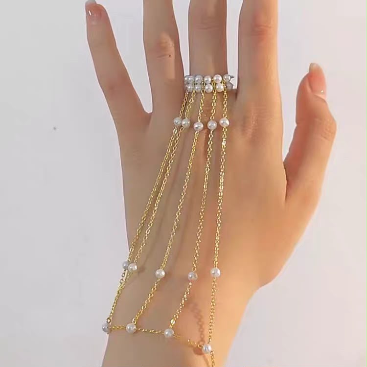 Turn Every Hand Movement Into Pure Elegance ( Pearl Cascade Hand Chain Bracelet )