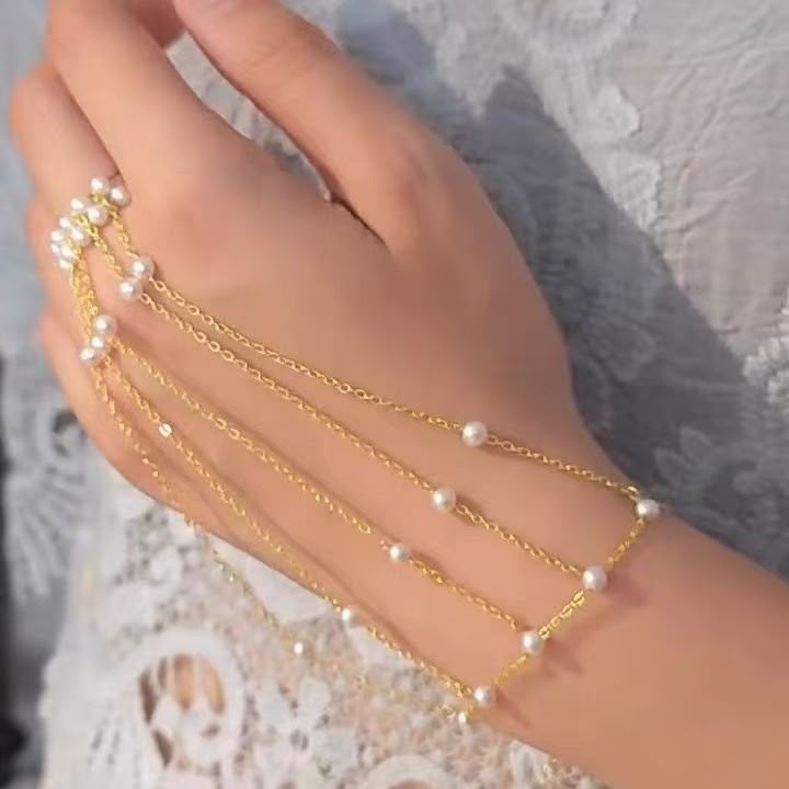 Turn Every Hand Movement Into Pure Elegance ( Pearl Cascade Hand Chain Bracelet )